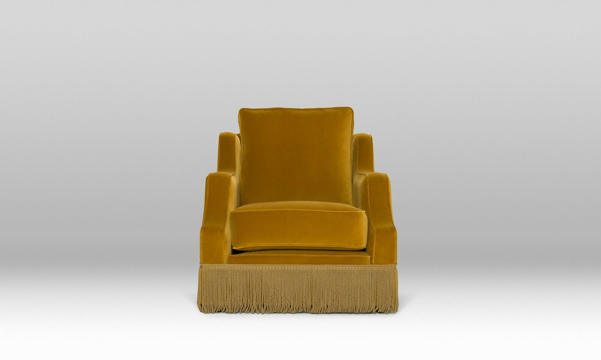 An ornate upholstered Atlanta chair with velvet fabric and tasseled fringe, designed by Orior, available  to buy on the-salon.com. SALON curates the finest , unique, handmade pieces from the interior industry's best makers and brands. Shop luxury furniture, lighting, rugs, art, antiques and vintage pieces and accessories from SALON interior designed rooms.