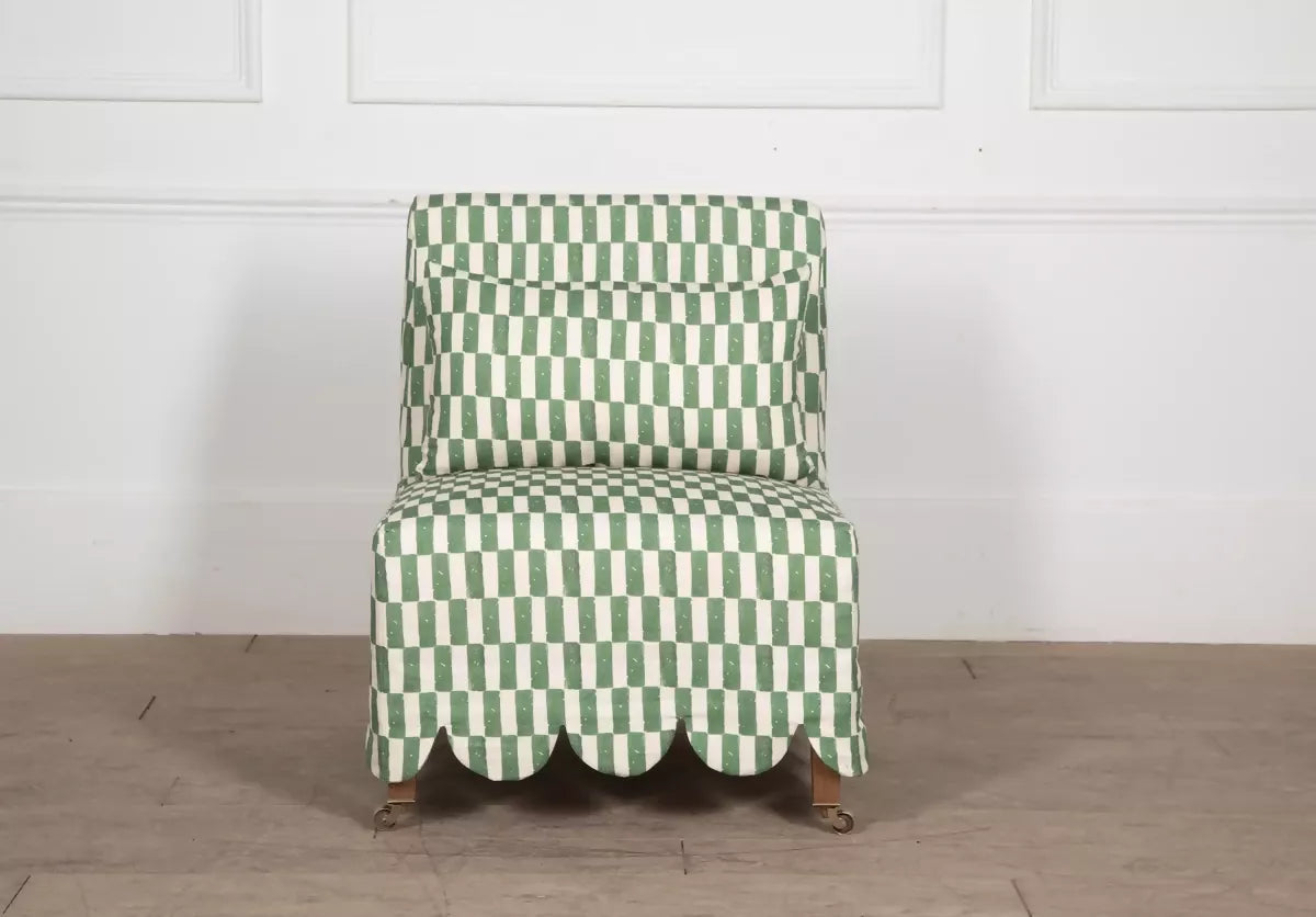 Green and white checkered chair on a wooden floor with a white wall background,  available  to buy on the-salon.com. SALON curates the finest , unique, handmade pieces from the interior industry's best makers and brands. Shop luxury furniture, lighting, rugs, art, antiques and vintage pieces and accessories from SALON interior designed rooms.