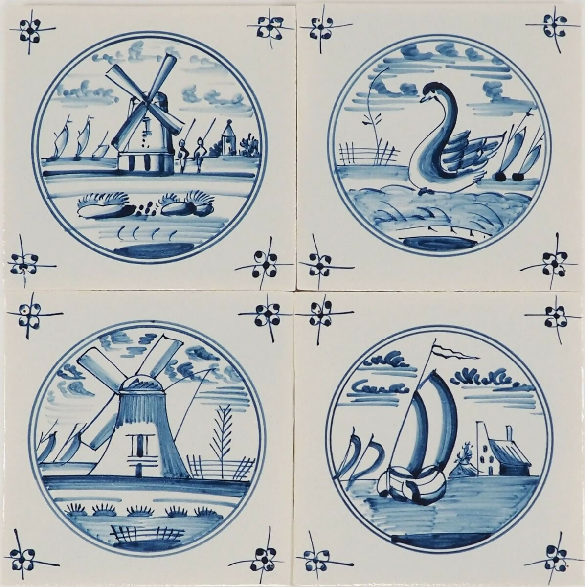 Set of four blue and white ceramic tiles with Dutch scenes,  available  to buy on the-salon.com. SALON curates the finest , unique, handmade pieces from the interior industry's best makers and brands. Shop luxury furniture, lighting, rugs, art, antiques and vintage pieces and accessories from SALON interior designed rooms.