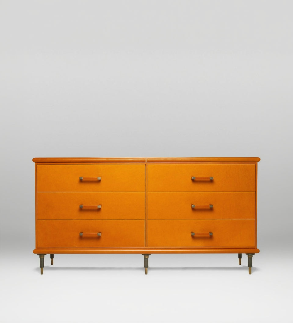 Orange dresser with six drawers on a white background