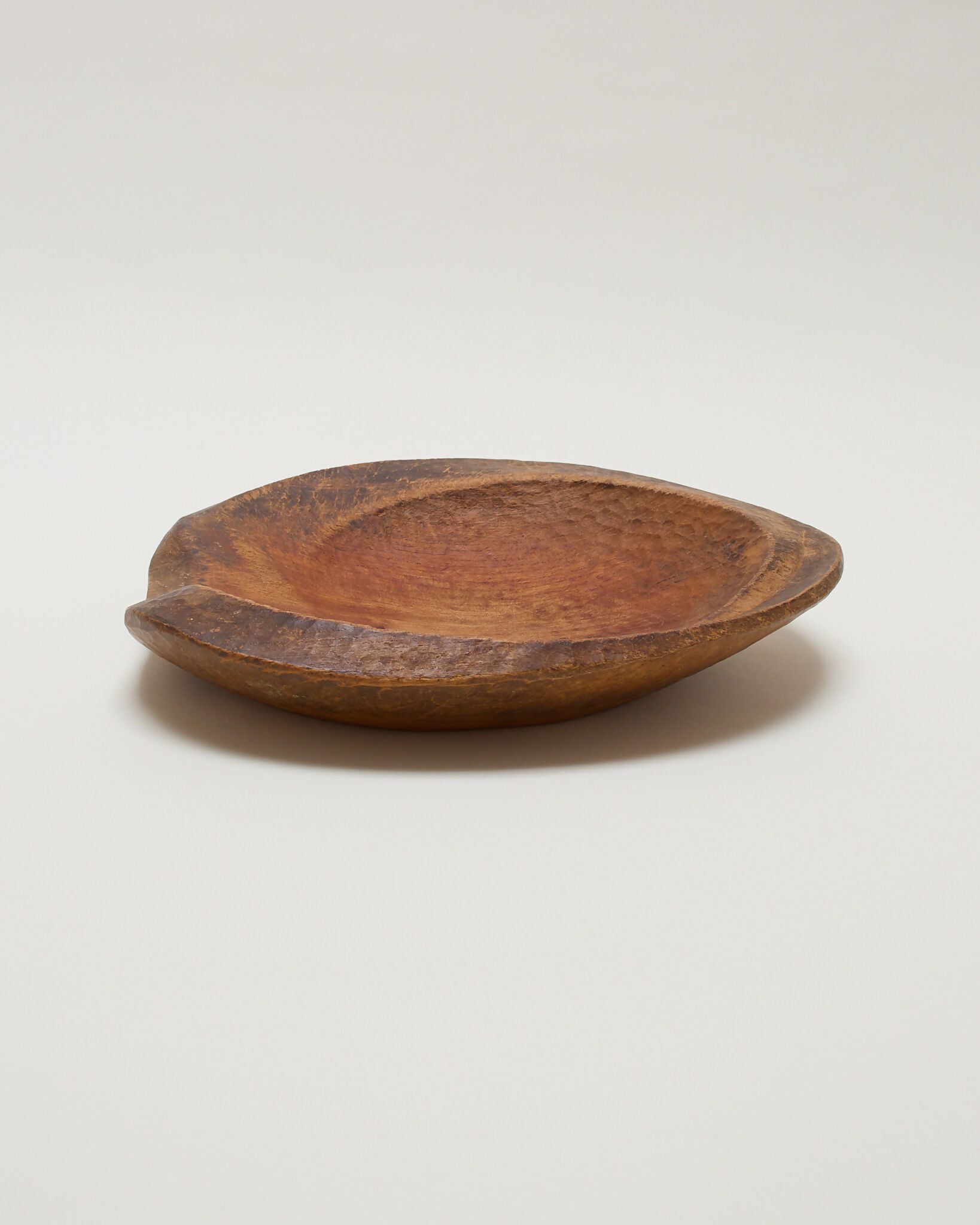 Wooden bowl on a plain background,  available  to buy on the-salon.com. SALON curates the finest , unique, handmade pieces from the interior industry's best makers and brands. Shop luxury furniture, lighting, rugs, art, antiques and vintage pieces and accessories from SALON interior designed rooms.