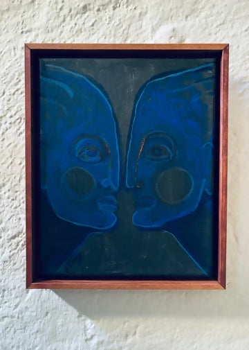 A framed artwork featuring abstract blue faces on a dark background,  available  to buy on the-salon.com. SALON curates the finest , unique, handmade pieces from the interior industry's best makers and brands. Shop luxury furniture, lighting, rugs, art, antiques and vintage pieces and accessories from SALON interior designed rooms.