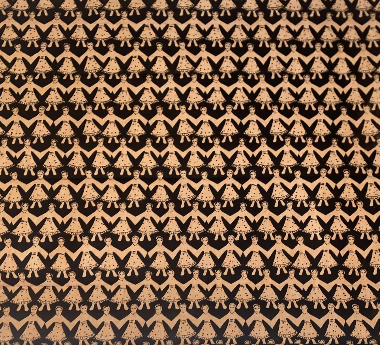 A patterned fabric featuring stylized figures with traditional Polish folk art influences, predominantly in black and a beige or light color, available  to buy on the-salon.com. SALON curates the finest , unique, handmade pieces from the interior industry's best makers and brands. Shop luxury furniture, lighting, rugs, art, antiques and vintage pieces and accessories from SALON interior designed rooms.