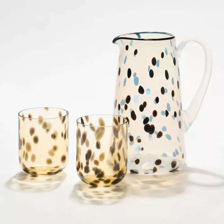 Polka dot pitcher and glasses on a white background,  available  to buy on the-salon.com. SALON curates the finest , unique, handmade pieces from the interior industry's best makers and brands. Shop luxury furniture, lighting, rugs, art, antiques and vintage pieces and accessories from SALON interior designed rooms.
