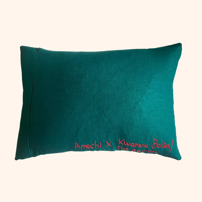 A rectangular cushion with red stitching 'Amechi x kwamana Bolson' ,  available  to buy on the-salon.com. SALON curates the finest , unique, handmade pieces from the interior industry's best makers and brands. Shop luxury furniture, lighting, rugs, art, antiques and vintage pieces and accessories from SALON interior designed rooms.