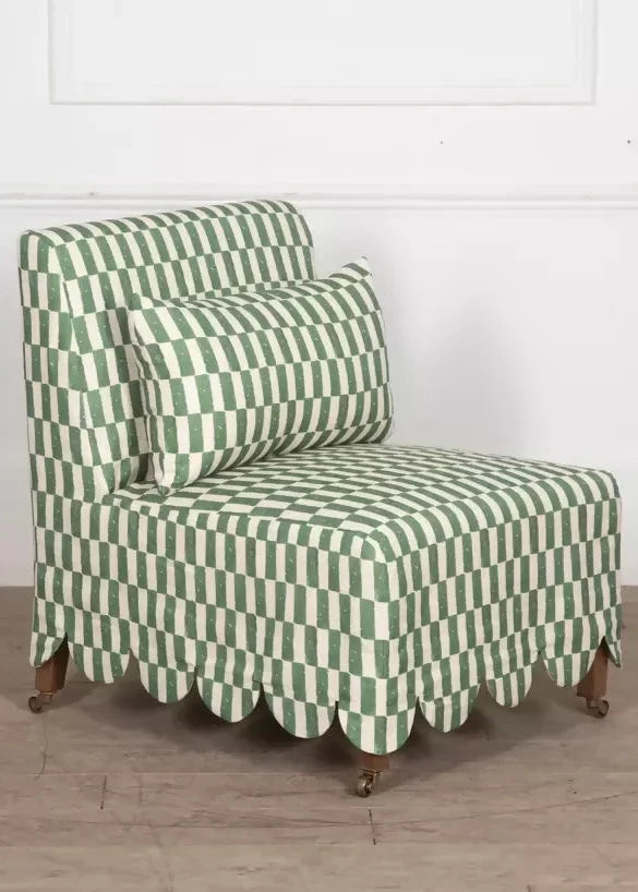 Green and white checkered chair on a wooden floor with a white wall background,  available  to buy on the-salon.com. SALON curates the finest , unique, handmade pieces from the interior industry's best makers and brands. Shop luxury furniture, lighting, rugs, art, antiques and vintage pieces and accessories from SALON interior designed rooms.