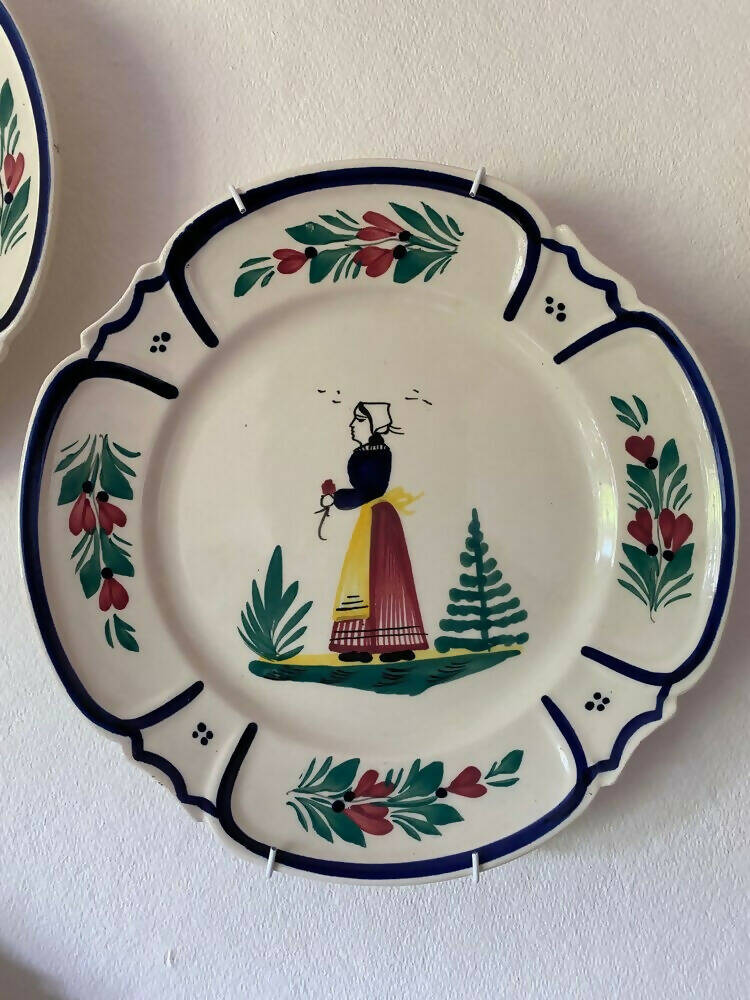 A  vintage French hand painted plates with a woman motif, displayed on a wall,  available  to buy on the-salon.com. SALON curates the finest , unique, handmade pieces from the interior industry's best makers and brands. Shop luxury furniture, lighting, rugs, art, antiques and vintage pieces and accessories from SALON interior designed rooms.