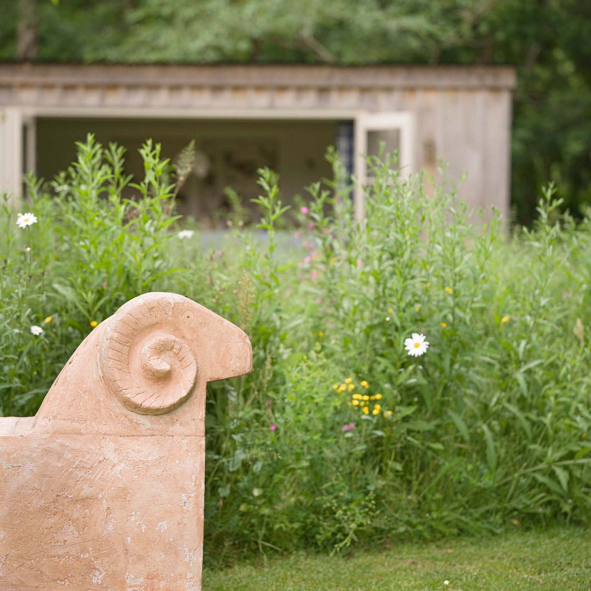 TABI JACKSON GEE EDIT: SHEEP BENCH (TERRACOTTA FINISH) BY FRED CLARK