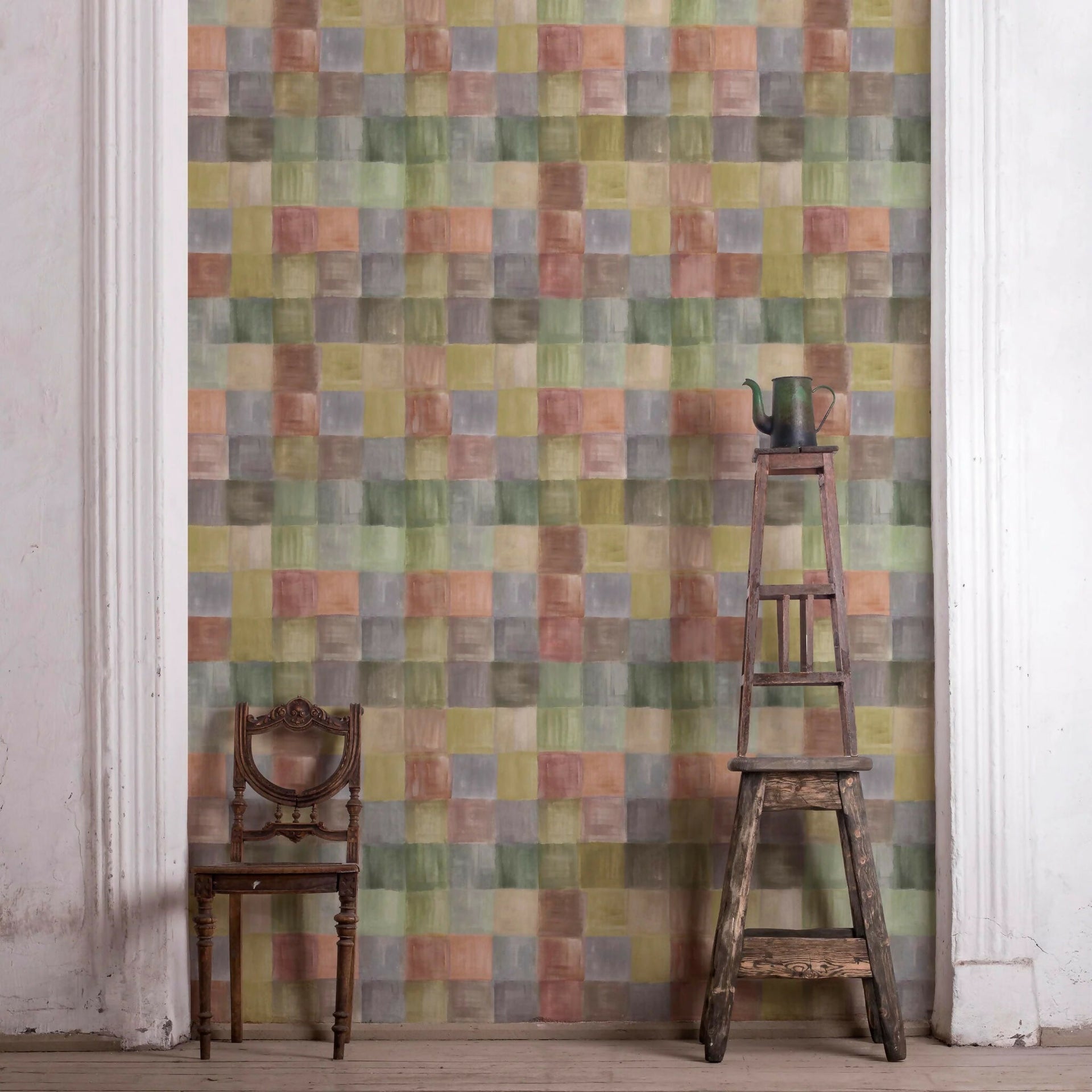 Multicolored checkered wallpaper with a wooden chair and ladder against it,  available  to buy on the-salon.com. SALON curates the finest , unique, handmade pieces from the interior industry's best makers and brands. Shop luxury furniture, lighting, rugs, art, antiques and vintage pieces and accessories from SALON interior designed rooms.
