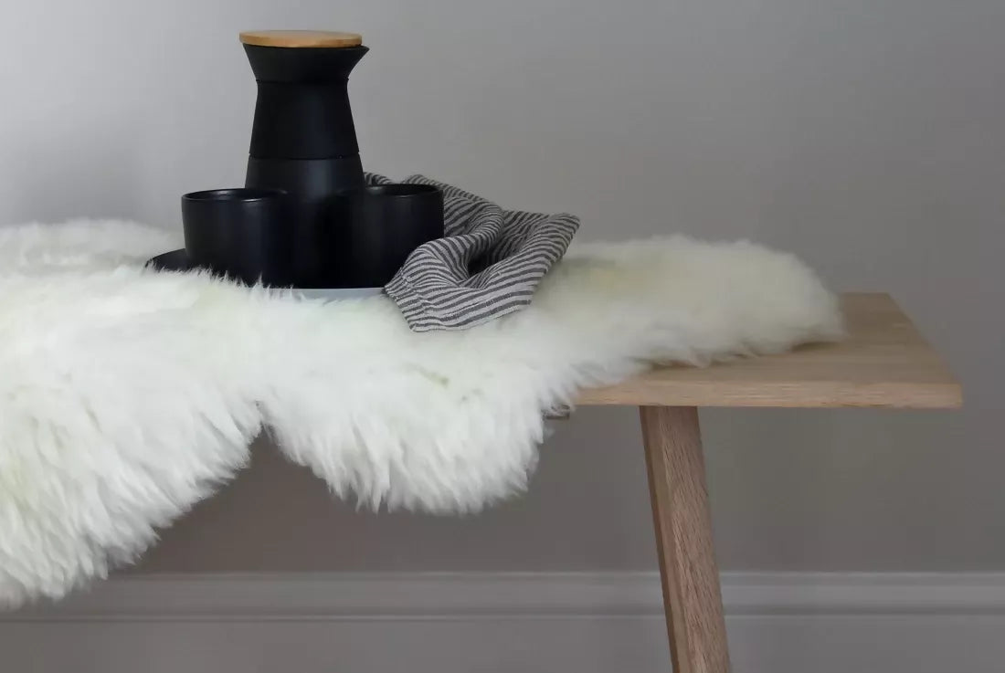 White sheepskin rug. The rug, available to buy from the-salon.com. SALON curates the finest unique handmade pieces from the interior industry's best makers and brands. Shop luxury furniture, lighting, rugs, art, antiques and vintage pieces and accessories from SALON interior designed rooms. 