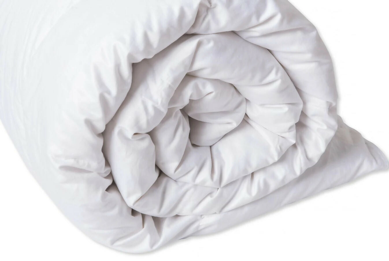 Rolled-up white comforter on a white background, available to buy on the-salon.com. SALON curates the finest , unique, handmade pieces from the interior industry's best makers and brands. Shop luxury furniture, lighting, rugs, art, antiques and vintage pieces and accessories from SALON interior designed rooms.