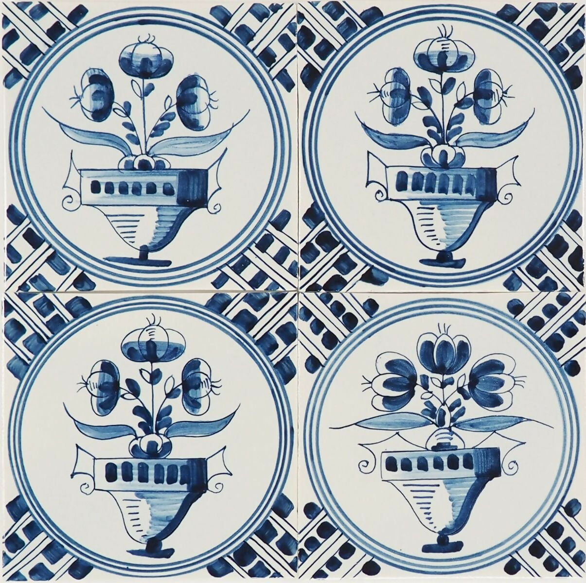 Decorative tiles with floral designs in blue and white,  available  to buy on the-salon.com. SALON curates the finest , unique, handmade pieces from the interior industry's best makers and brands. Shop luxury furniture, lighting, rugs, art, antiques and vintage pieces and accessories from SALON interior designed rooms.