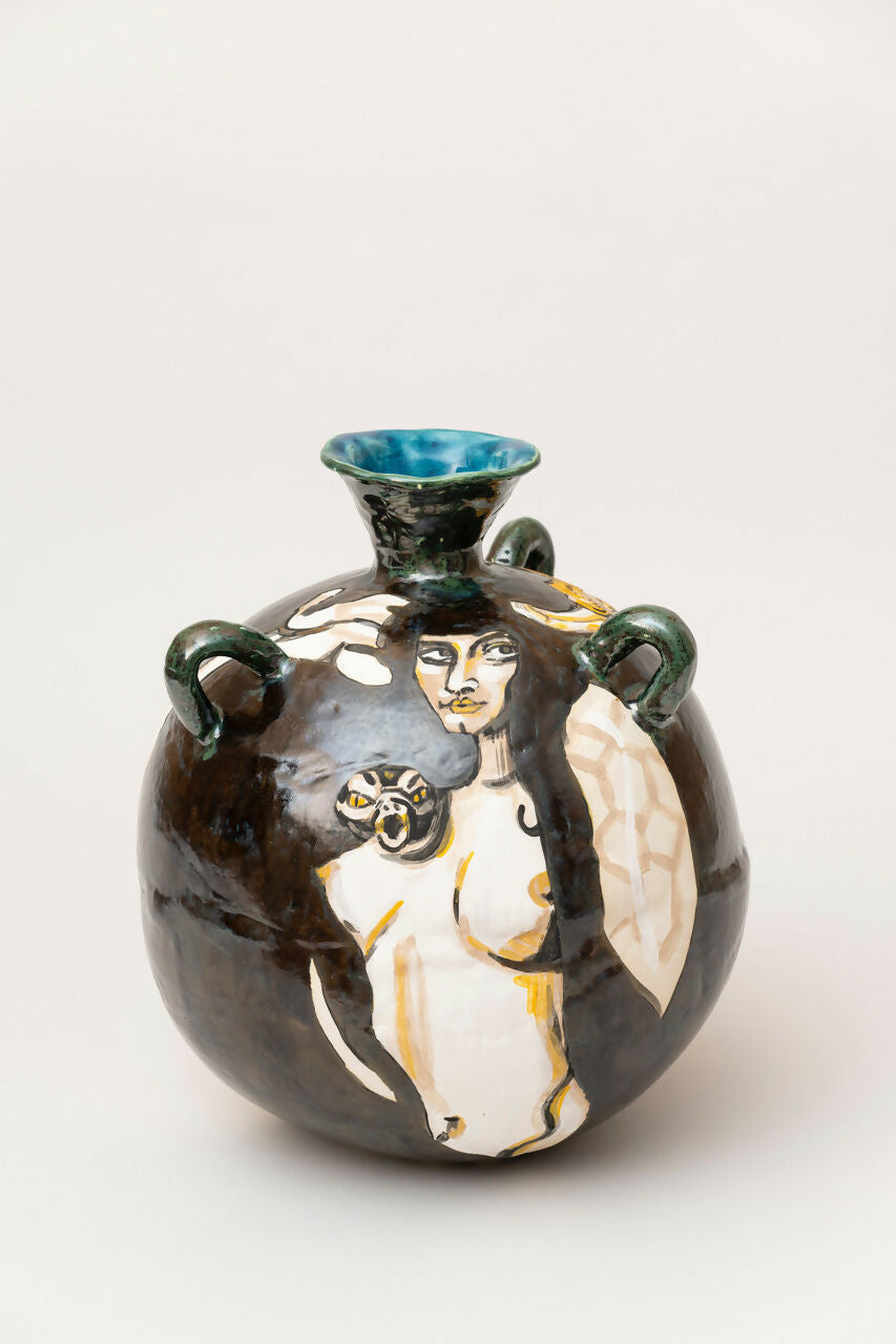 Ceramic vase with artistic depiction of a figure and animal on a white background,  available  to buy on the-salon.com. SALON curates the finest , unique, handmade pieces from the interior industry's best makers and brands. Shop luxury furniture, lighting, rugs, art, antiques and vintage pieces and accessories from SALON interior designed rooms.