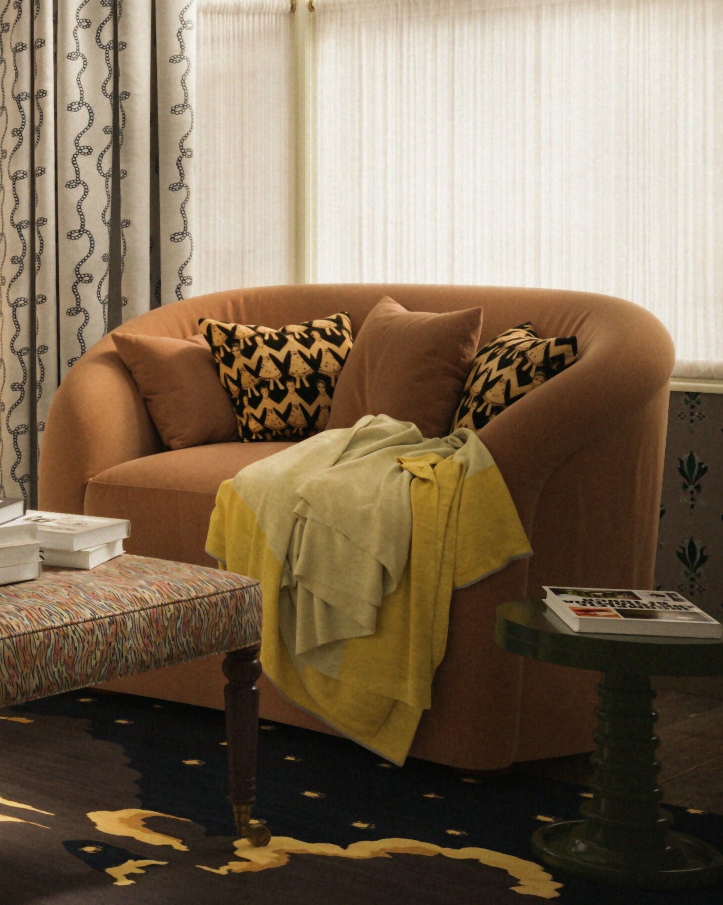 Living room with patterned walls, a purple sofa, and a brown armchair,  available  to buy on the-salon.com. SALON curates the finest , unique, handmade pieces from the interior industry's best makers and brands. Shop luxury furniture, lighting, rugs, art, antiques and vintage pieces and accessories from SALON interior designed rooms.