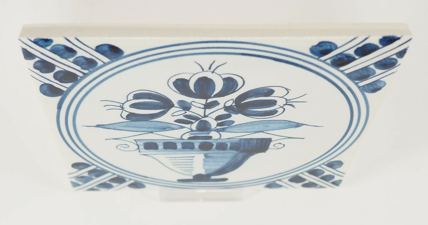 Decorative ceramic tile with blue floral design on a white background,  available  to buy on the-salon.com. SALON curates the finest , unique, handmade pieces from the interior industry's best makers and brands. Shop luxury furniture, lighting, rugs, art, antiques and vintage pieces and accessories from SALON interior designed rooms.