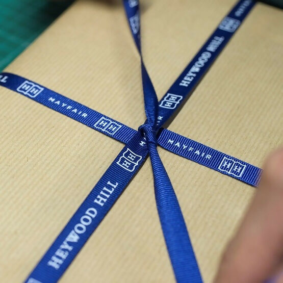 The Heywood Hill blue ribbon packaging,  available  to buy on the-salon.com. SALON curates the finest , unique, handmade pieces from the interior industry's best makers and brands. Shop luxury furniture, lighting, rugs, art, antiques and vintage pieces and accessories from SALON interior designed rooms.