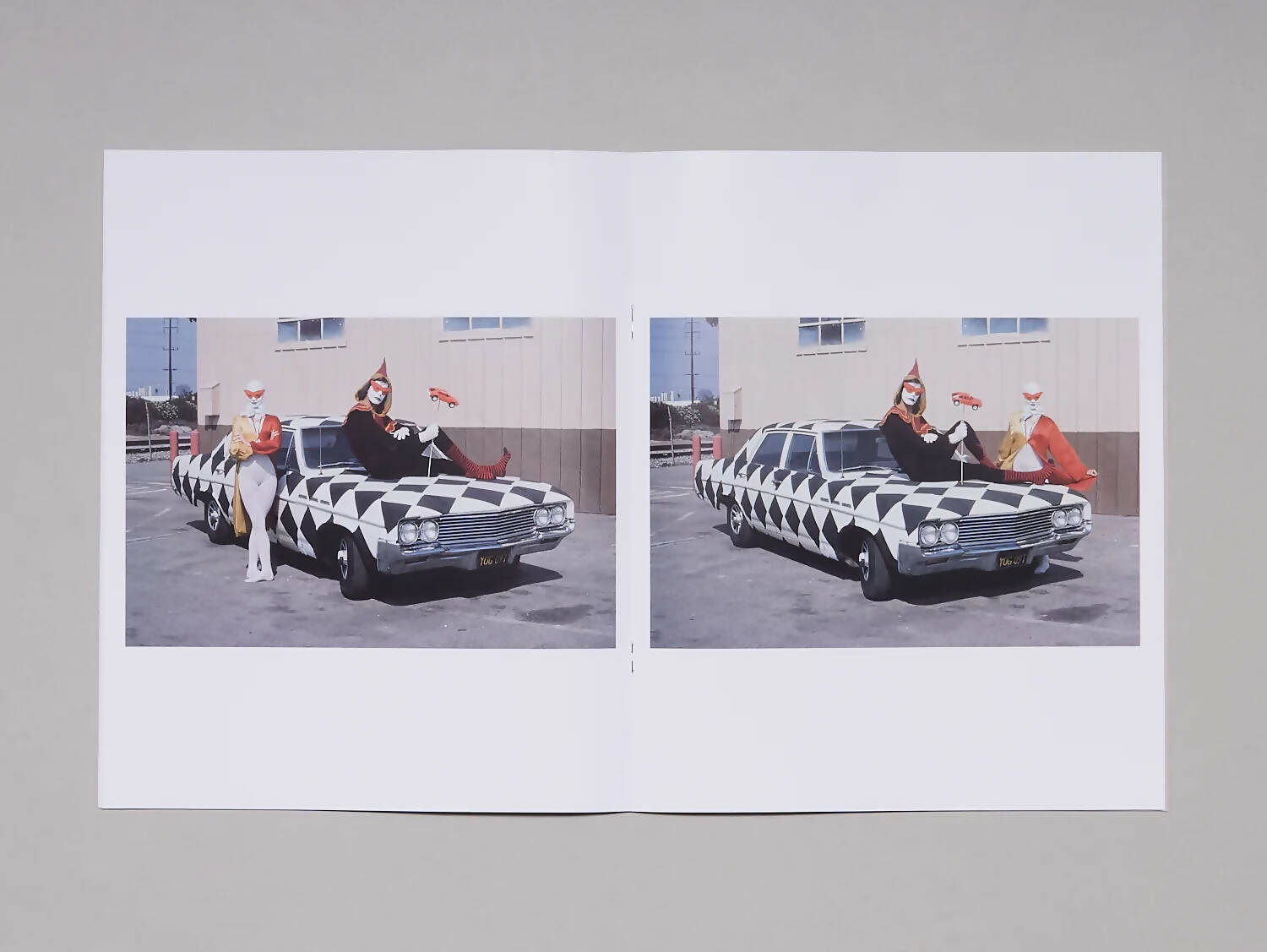 An image of an open book containing two images of a couple dressed up as circus performers on/next to a car painted as a clown car with a diamanté pattern, available  to buy on the-salon.com. SALON curates the finest , unique, handmade pieces from the interior industry's best makers and brands. Shop luxury furniture, lighting, rugs, art, antiques and vintage pieces and accessories from SALON interior designed rooms.