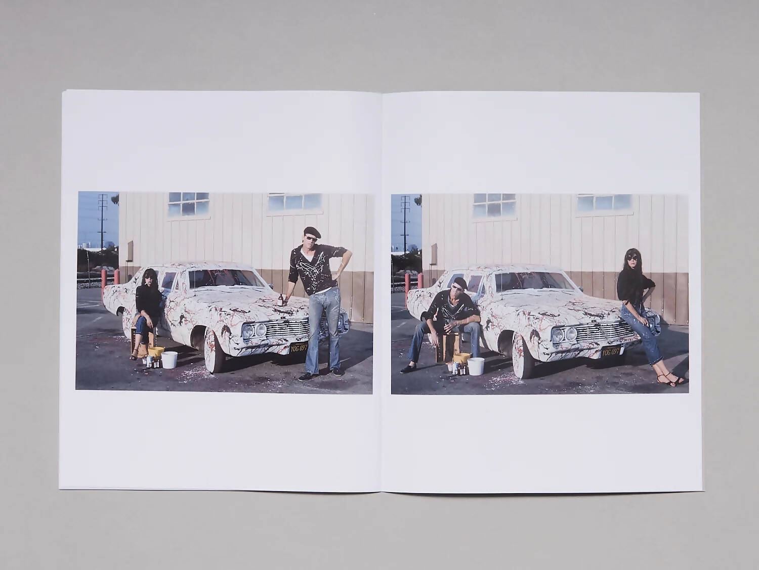 An image of an open book, which pages contain two images of a man and a woman next to a beaten-up white car with graffiti, available  to buy on the-salon.com. SALON curates the finest , unique, handmade pieces from the interior industry's best makers and brands. Shop luxury furniture, lighting, rugs, art, antiques and vintage pieces and accessories from SALON interior designed rooms.