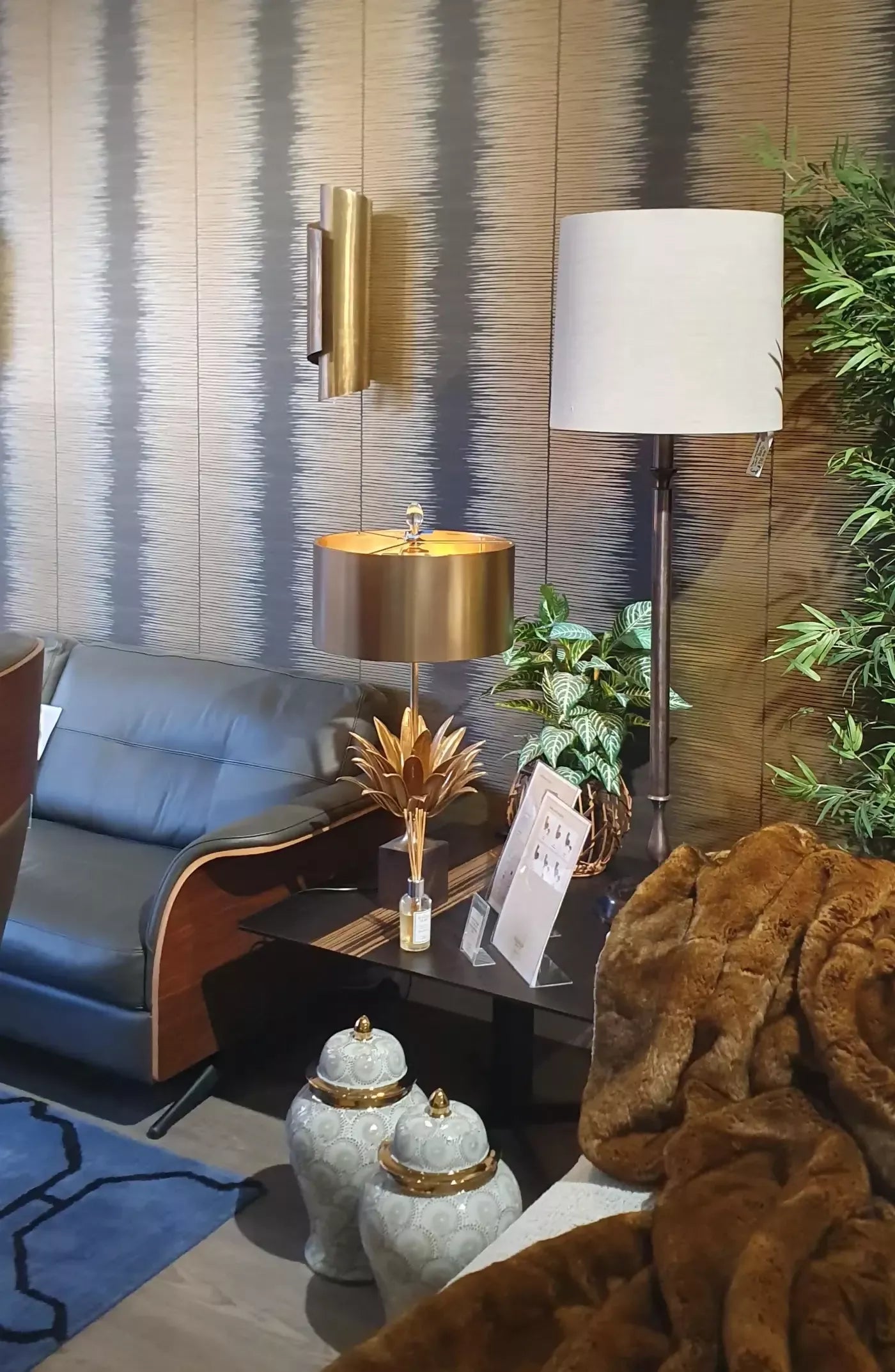 THE CURVE WALL SCONCES IN ANTIQUE BRASS BY ANDREW KORNAT