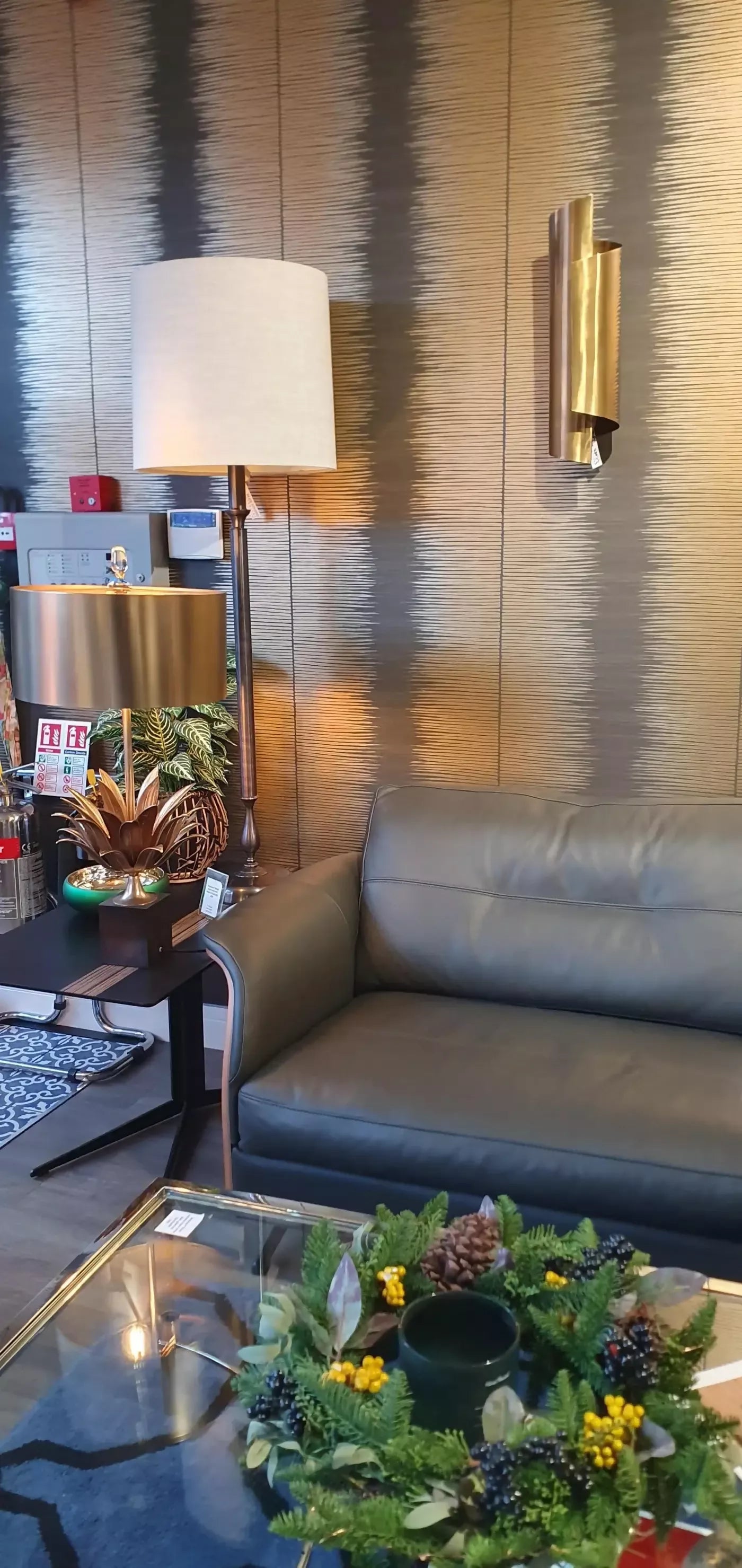 THE CURVE WALL SCONCES IN ANTIQUE BRASS BY ANDREW KORNAT