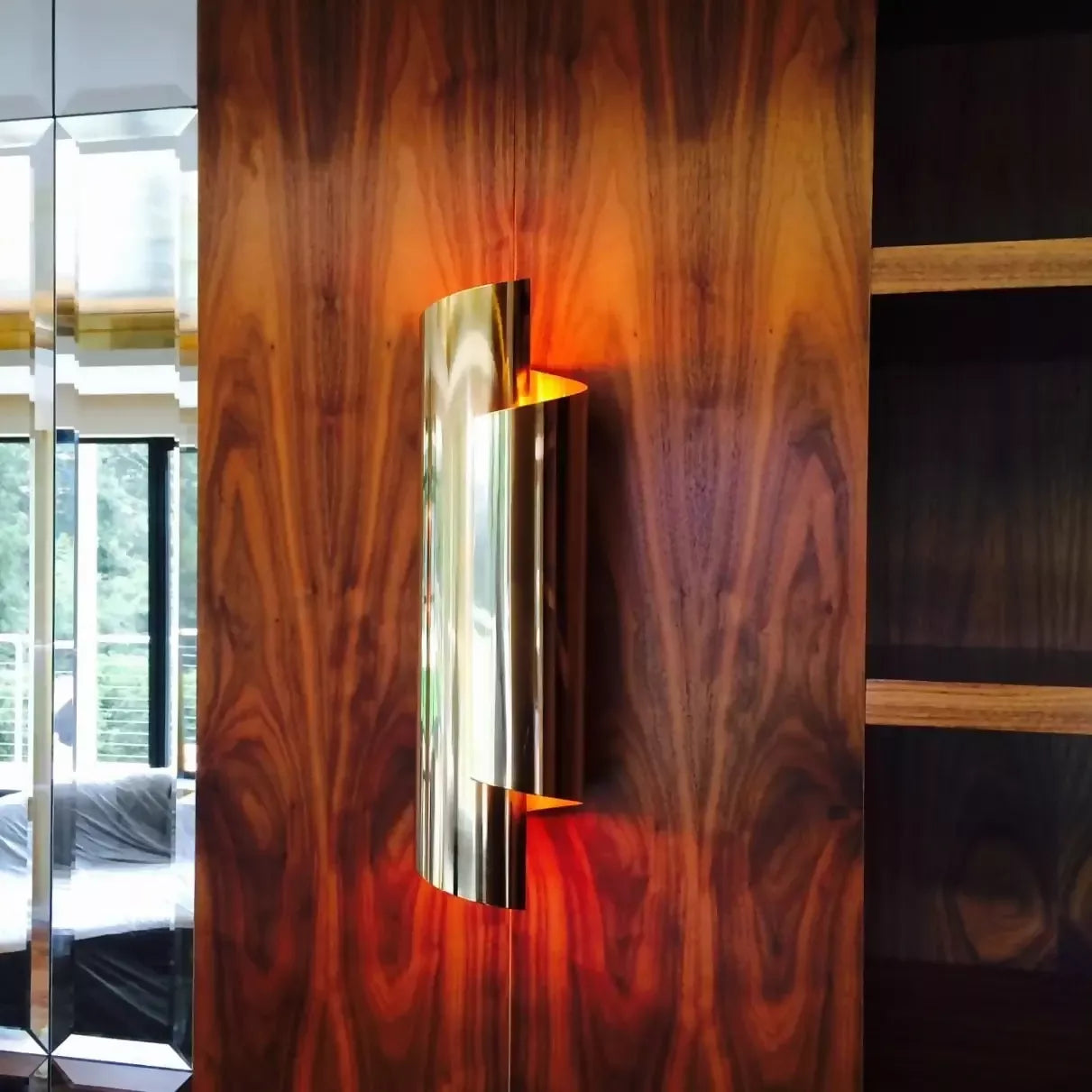 THE CURVE WALL SCONCES IN ANTIQUE BRASS BY ANDREW KORNAT