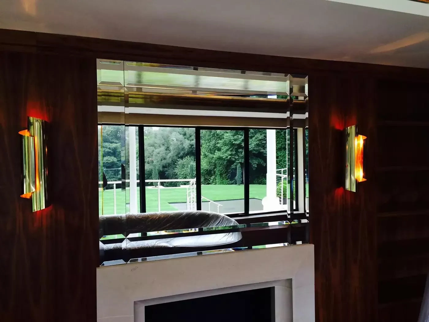 THE CURVE WALL SCONCES IN BLACK BRASS BY ANDREW KORNAT