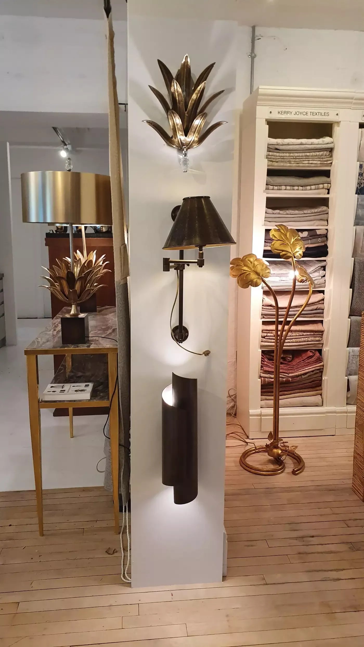 THE CURVE WALL SCONCES IN BLACK BRASS BY ANDREW KORNAT