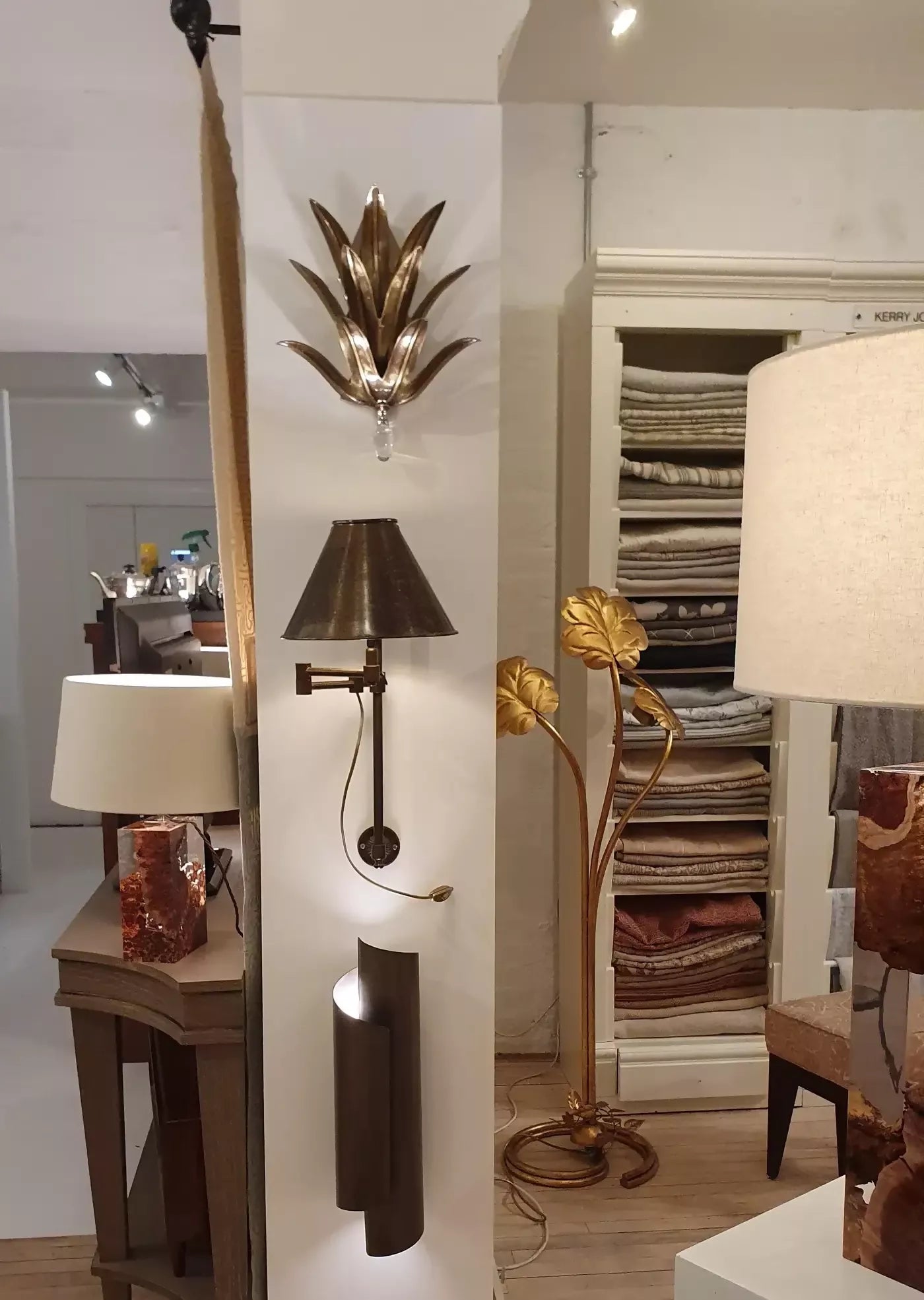 THE CURVE WALL SCONCES IN BLACK BRASS BY ANDREW KORNAT