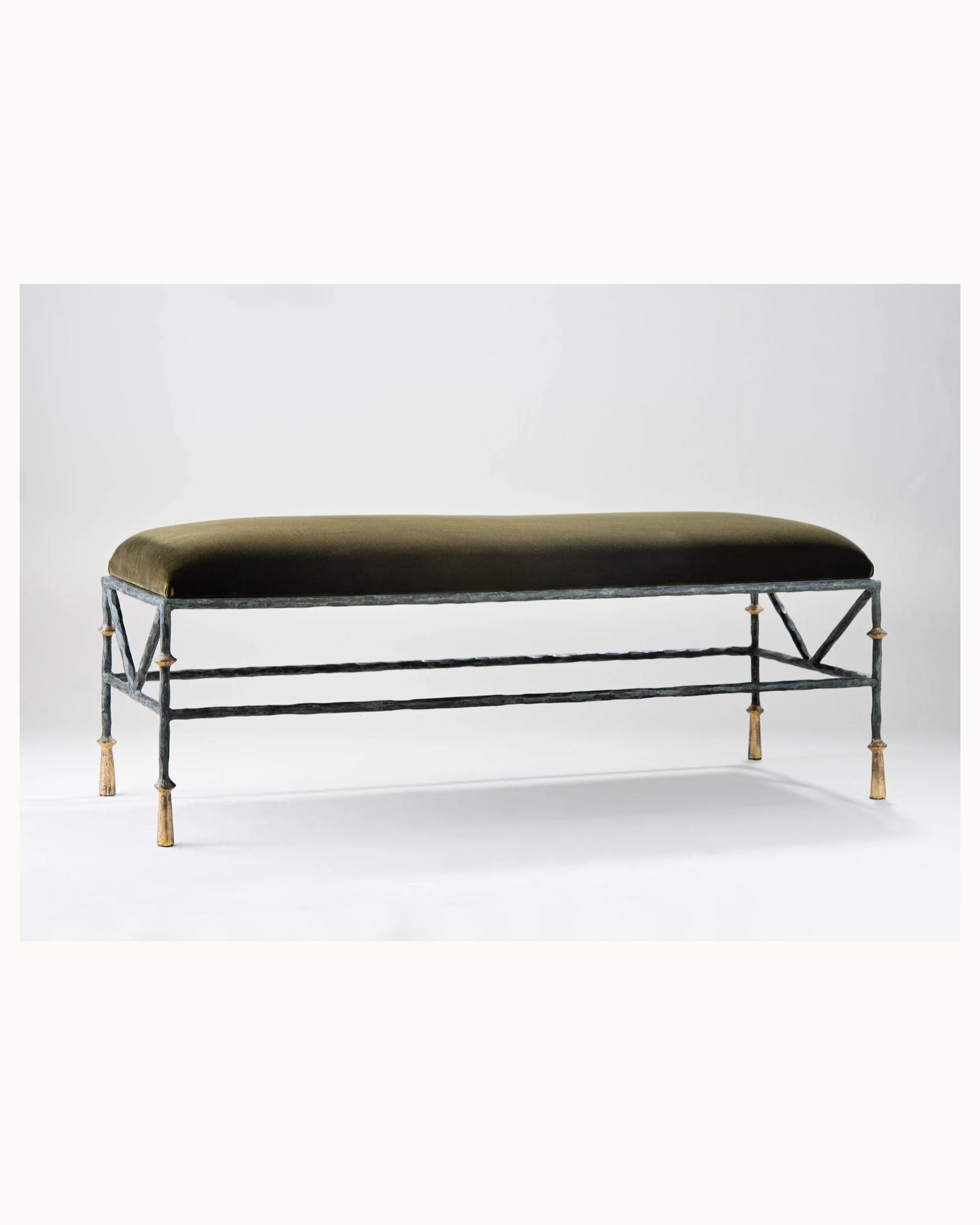 Decorative bench with green cushion on a white background,  available  to buy on the-salon.com. SALON curates the finest , unique, handmade pieces from the interior industry's best makers and brands. Shop luxury furniture, lighting, rugs, art, antiques and vintage pieces and accessories from SALON interior designed rooms.