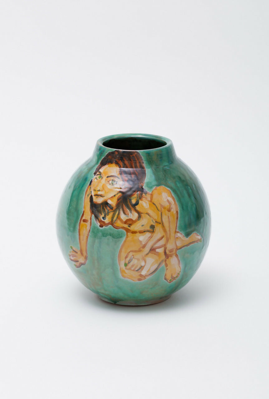 Green ceramic vase with a figurative design on a white background,  available  to buy on the-salon.com. SALON curates the finest , unique, handmade pieces from the interior industry's best makers and brands. Shop luxury furniture, lighting, rugs, art, antiques and vintage pieces and accessories from SALON interior designed rooms.