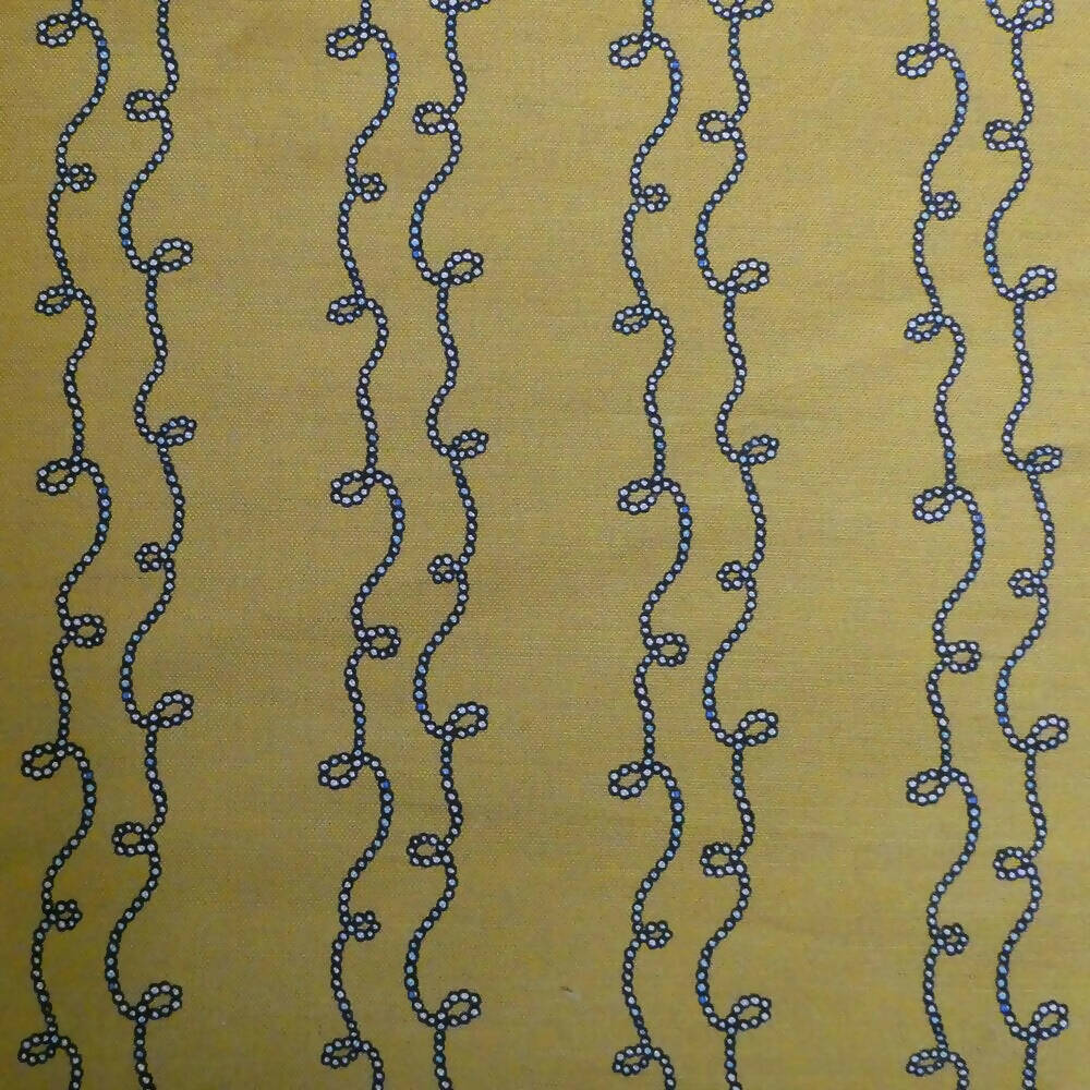 A swatch of fabric featuring a yellow background with a blue geometric pattern consisting of twisted shapes,  available  to buy on the-salon.com. SALON curates the finest , unique, handmade pieces from the interior industry's best makers and brands. Shop luxury furniture, lighting, rugs, art, antiques and vintage pieces and accessories from SALON interior designed rooms.