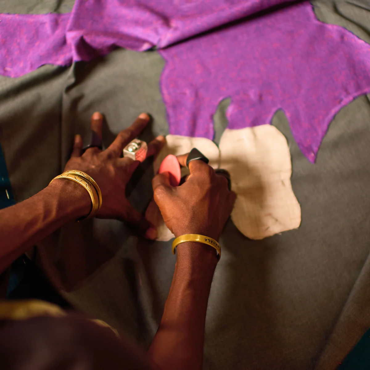 An image of a person, working on the wall hanging,  available  to buy on the-salon.com. SALON curates the finest , unique, handmade pieces from the interior industry's best makers and brands. Shop luxury furniture, lighting, rugs, art, antiques and vintage pieces and accessories from SALON interior designed rooms.