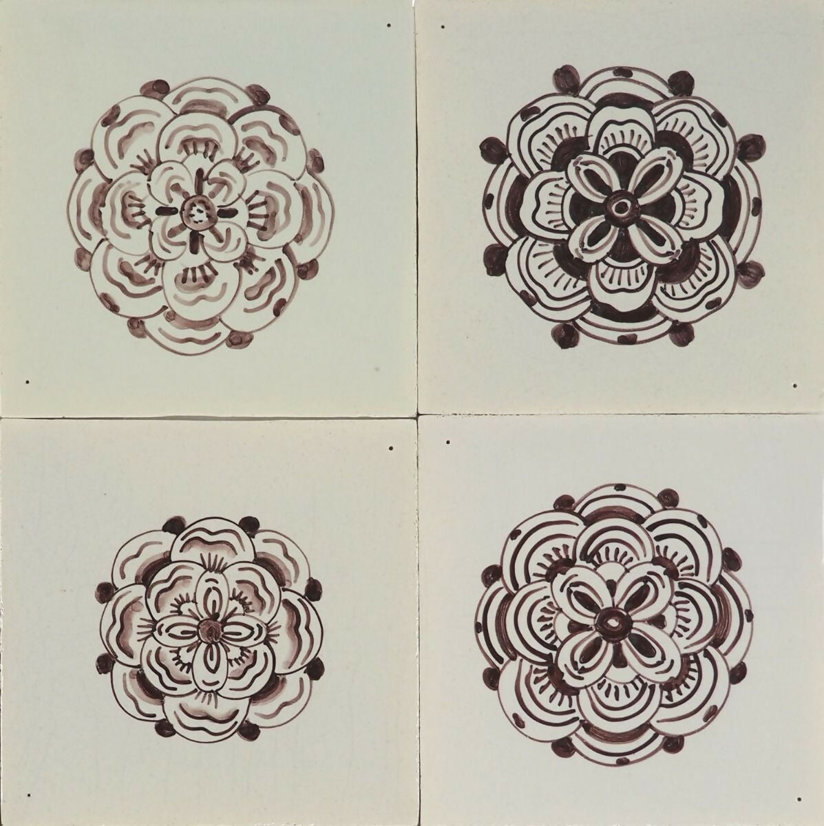 Four floral mandala designs on a tiled background,  available  to buy on the-salon.com. SALON curates the finest , unique, handmade pieces from the interior industry's best makers and brands. Shop luxury furniture, lighting, rugs, art, antiques and vintage pieces and accessories from SALON interior designed rooms.