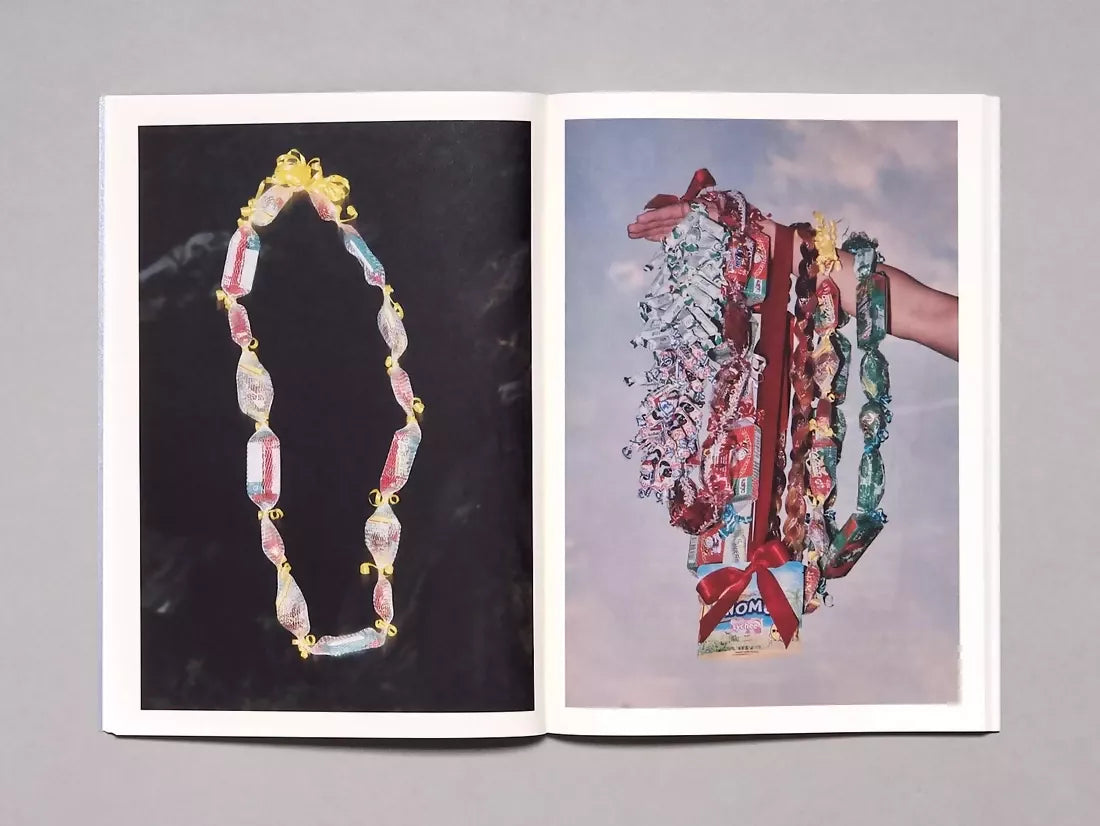 An image of an open book to two images one being a necklace of sweets and the other being an image of many necklaces of sweets,  available  to buy on the-salon.com. SALON curates the finest , unique, handmade pieces from the interior industry's best makers and brands. Shop luxury furniture, lighting, rugs, art, antiques and vintage pieces and accessories from SALON interior designed rooms.