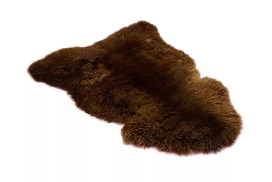 Brown sheepskin rug. The rug, available to buy from the-salon.com. SALON curates the finest unique handmade pieces from the interior industry's best makers and brands. Shop luxury furniture, lighting, rugs, art, antiques and vintage pieces and accessories from SALON interior designed rooms.