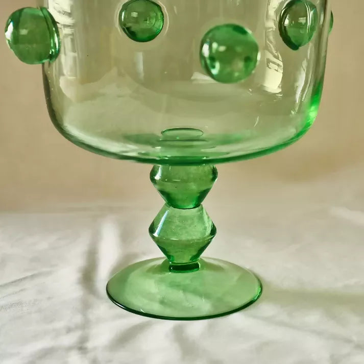 Closeup on the green trifle glass, focusing on the stem, available  to buy on the-salon.com. SALON curates the finest , unique, handmade pieces from the interior industry's best makers and brands. Shop luxury furniture, lighting, rugs, art, antiques and vintage pieces and accessories from SALON interior designed rooms.