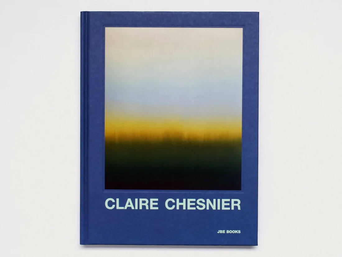 The cover of the 'CLAIRE CHESNIER' book by ANETENNE BOOKS features a abstract artwork with a gradient of colors resembling a sunset or sunrise,  available  to buy on the-salon.com. SALON curates the finest , unique, handmade pieces from the interior industry's best makers and brands. Shop luxury furniture, lighting, rugs, art, antiques and vintage pieces and accessories from SALON interior designed rooms.