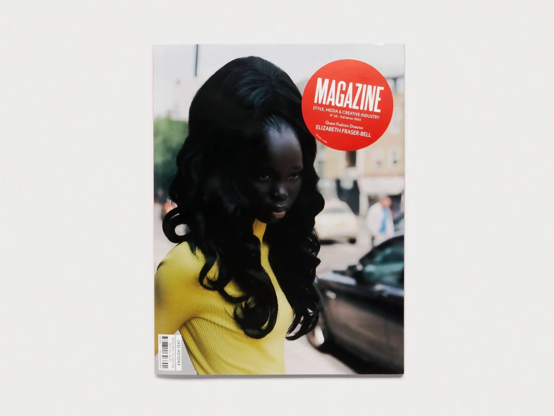 Cover of MAGAZINE MAGAZINE ISSUE 42 featuring a person in a yellow garment, with the magazine's name and issue number prominently displayed available  to buy on the-salon.com. SALON curates the finest , unique, handmade pieces from the interior industry's best makers and brands. Shop luxury furniture, lighting, rugs, art, antiques and vintage pieces and accessories from SALON interior designed rooms.