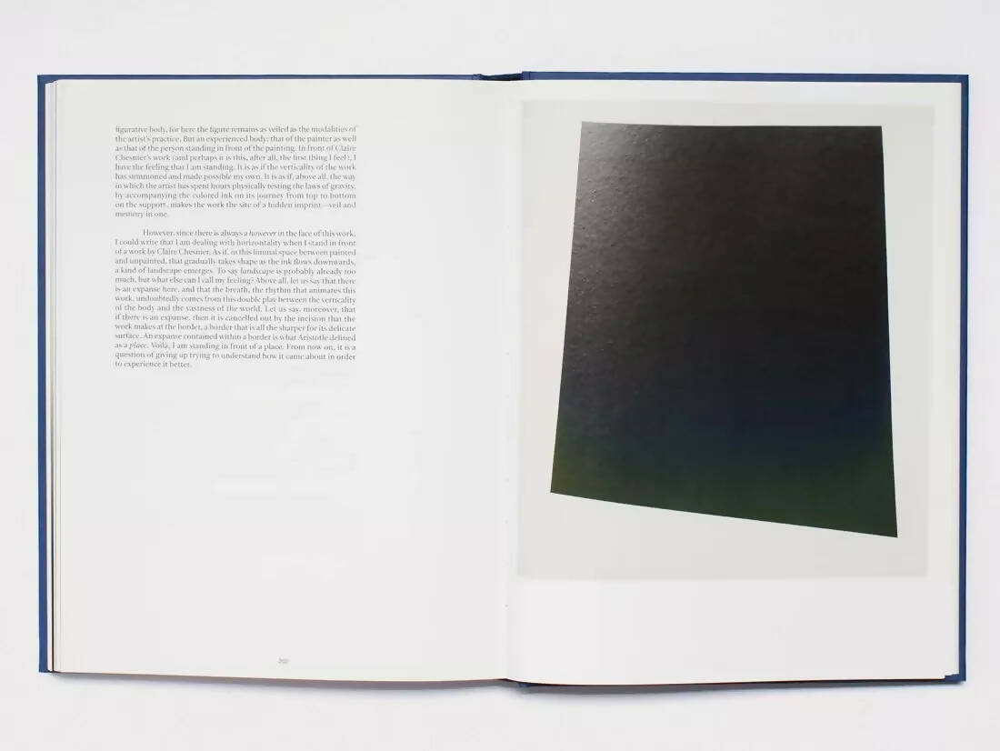 An image of an open page, one side with text on a white page and the other containing a black quadrilateral, available  to buy on the-salon.com. SALON curates the finest , unique, handmade pieces from the interior industry's best makers and brands. Shop luxury furniture, lighting, rugs, art, antiques and vintage pieces and accessories from SALON interior designed rooms.