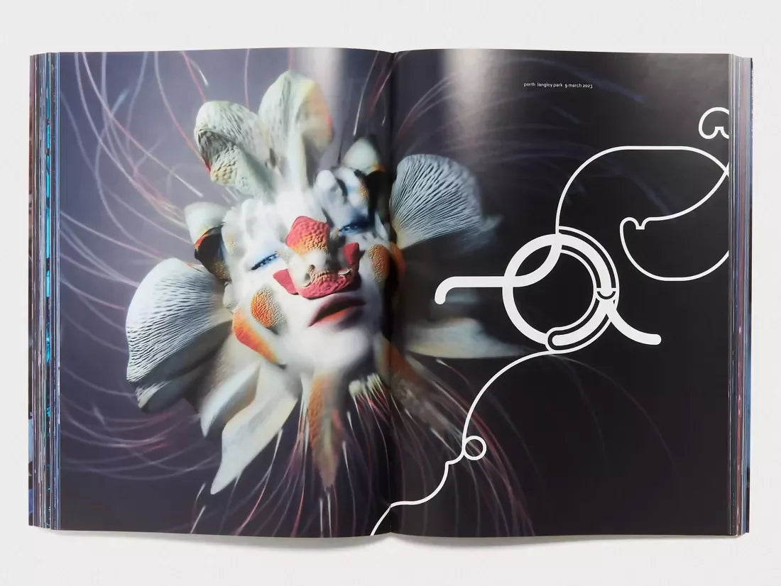 An image of an open book with an image of a woman as a flower, her face white with pigments of red and petals coming off her skin on a black background, available  to buy on the-salon.com. SALON curates the finest , unique, handmade pieces from the interior industry's best makers and brands. Shop luxury furniture, lighting, rugs, art, antiques and vintage pieces and accessories from SALON interior designed rooms.