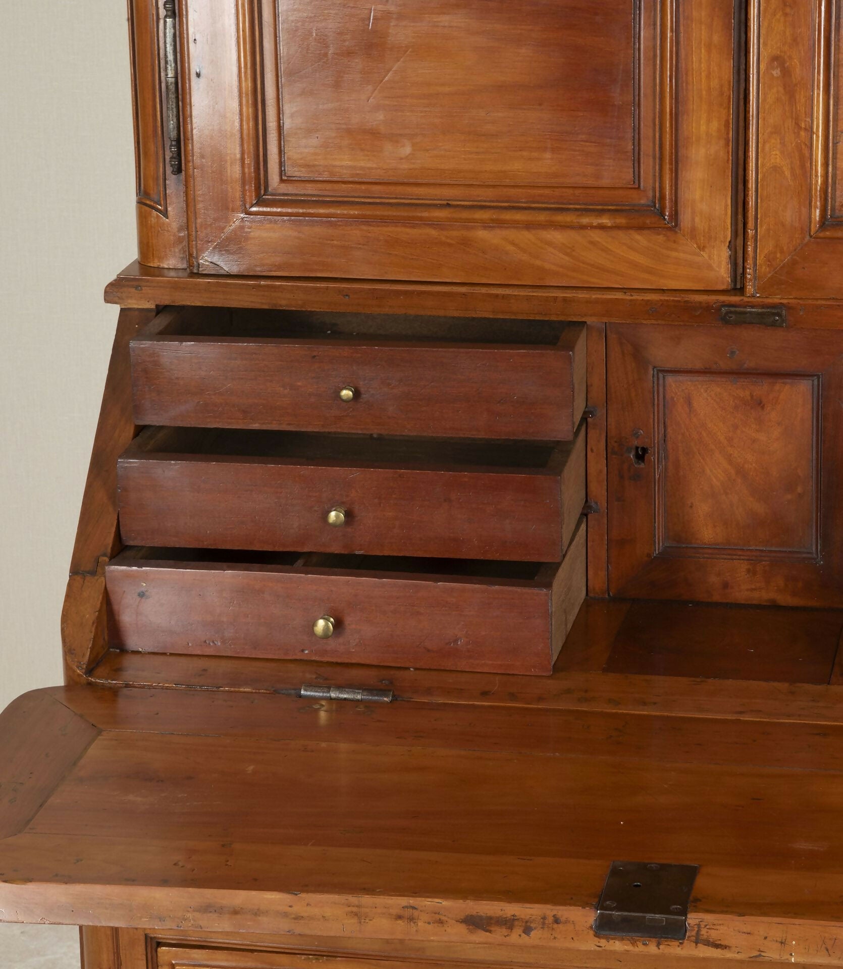 Wooden dresser with drawers and a closed cabinet door,  available  to buy on the-salon.com. SALON curates the finest , unique, handmade pieces from the interior industry's best makers and brands. Shop luxury furniture, lighting, rugs, art, antiques and vintage pieces and accessories from SALON interior designed rooms.