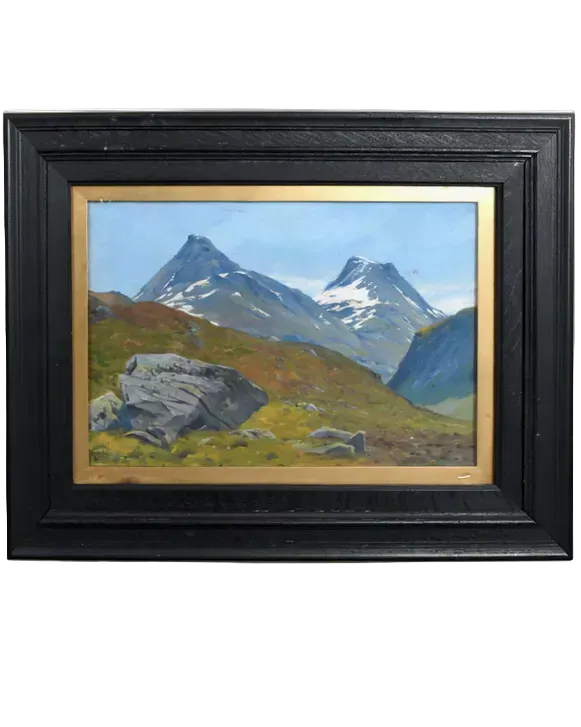 A framed landscape painting depicting snow-capped mountain peaks, rocky hills, and a blue sky, set in a black frame with a gold inner border.
