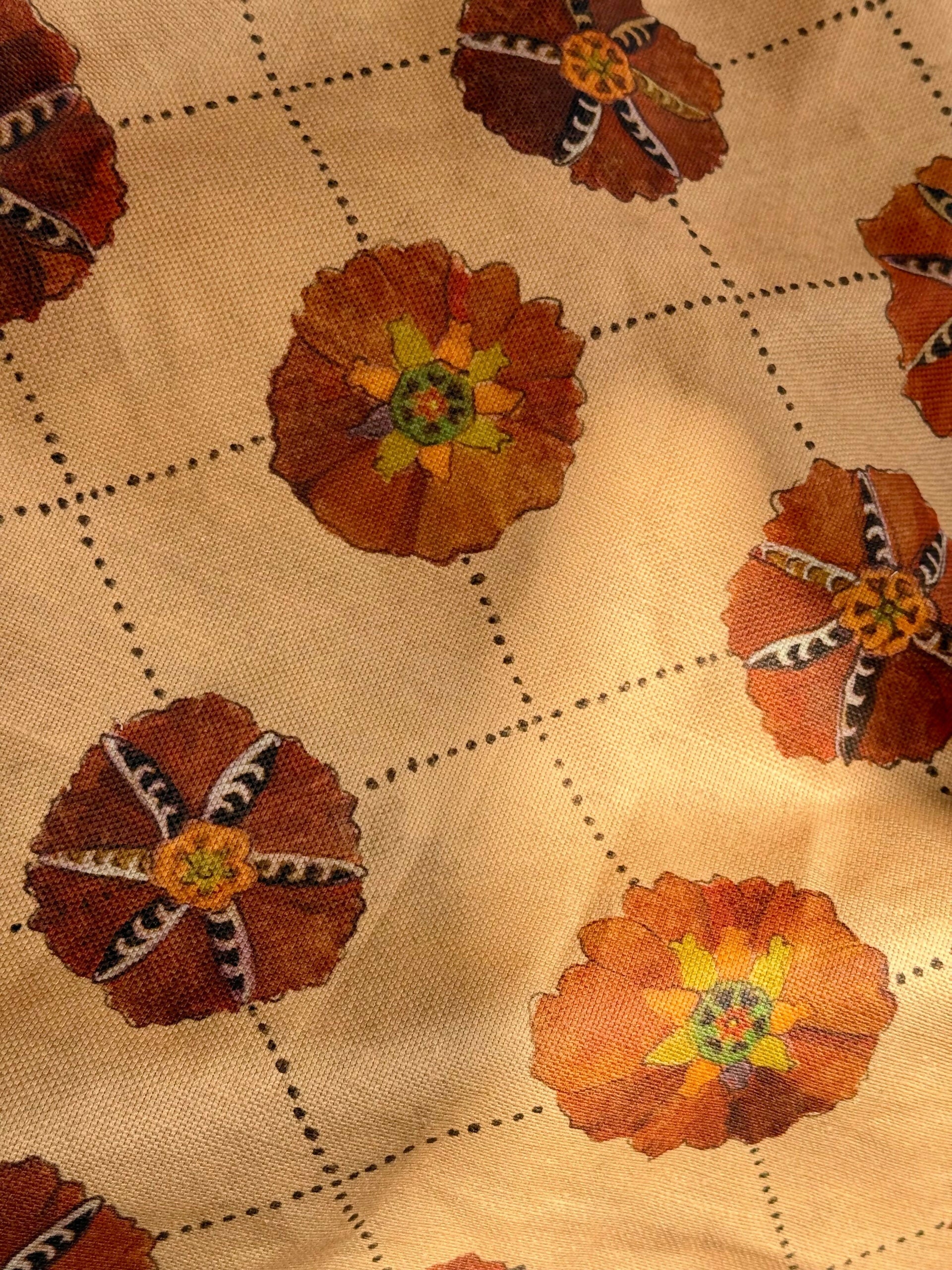 A piece of suzani fabric with floral patterns in beige, brown, and multicolor hues,  available  to buy on the-salon.com. SALON curates the finest , unique, handmade pieces from the interior industry's best makers and brands. Shop luxury furniture, lighting, rugs, art, antiques and vintage pieces and accessories from SALON interior designed rooms.