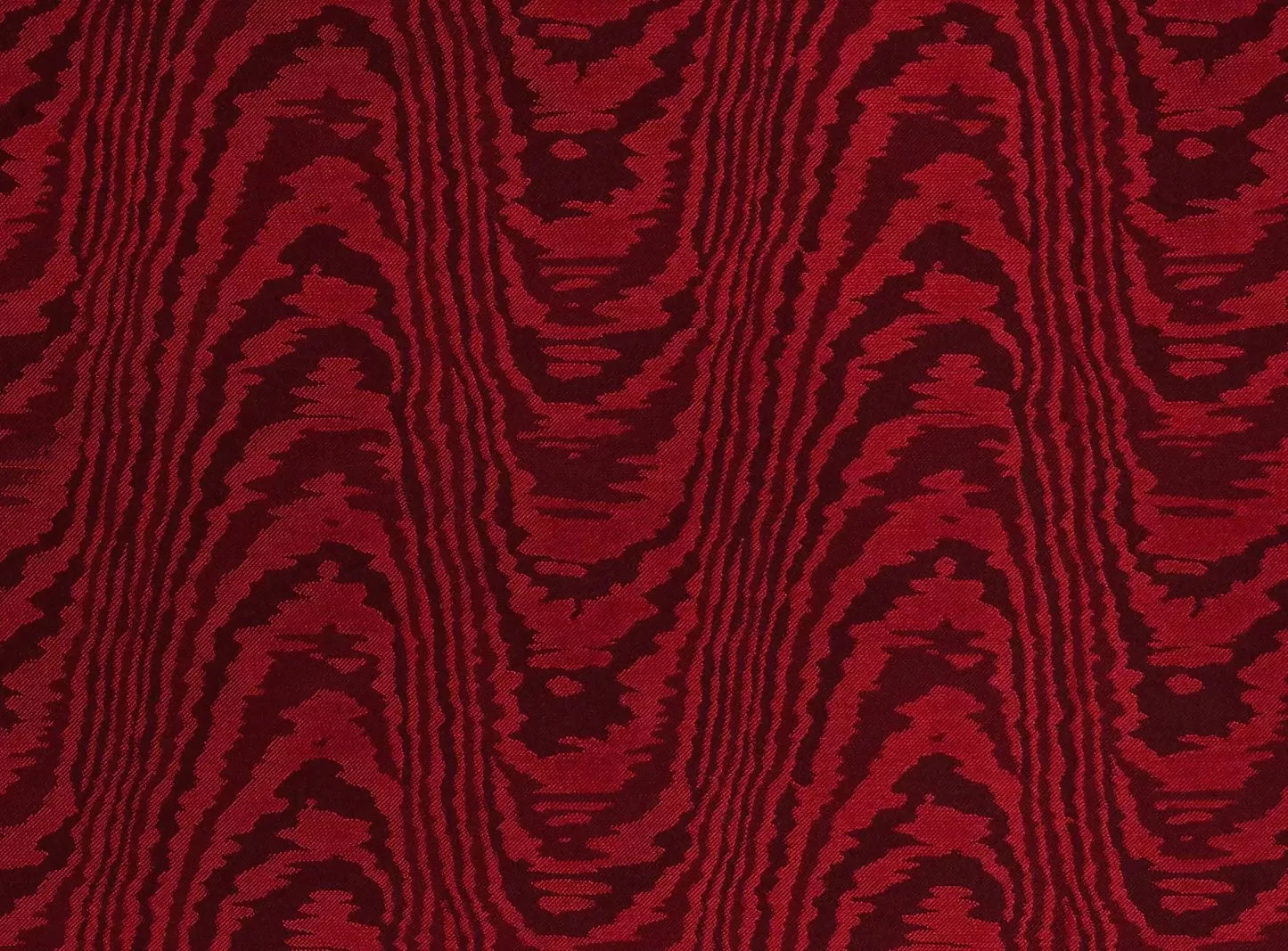 An image of a red moiré patterned fabric,  available  to buy on the-salon.com. SALON curates the finest , unique, handmade pieces from the interior industry's best makers and brands. Shop luxury furniture, lighting, rugs, art, antiques and vintage pieces and accessories from SALON interior designed rooms.