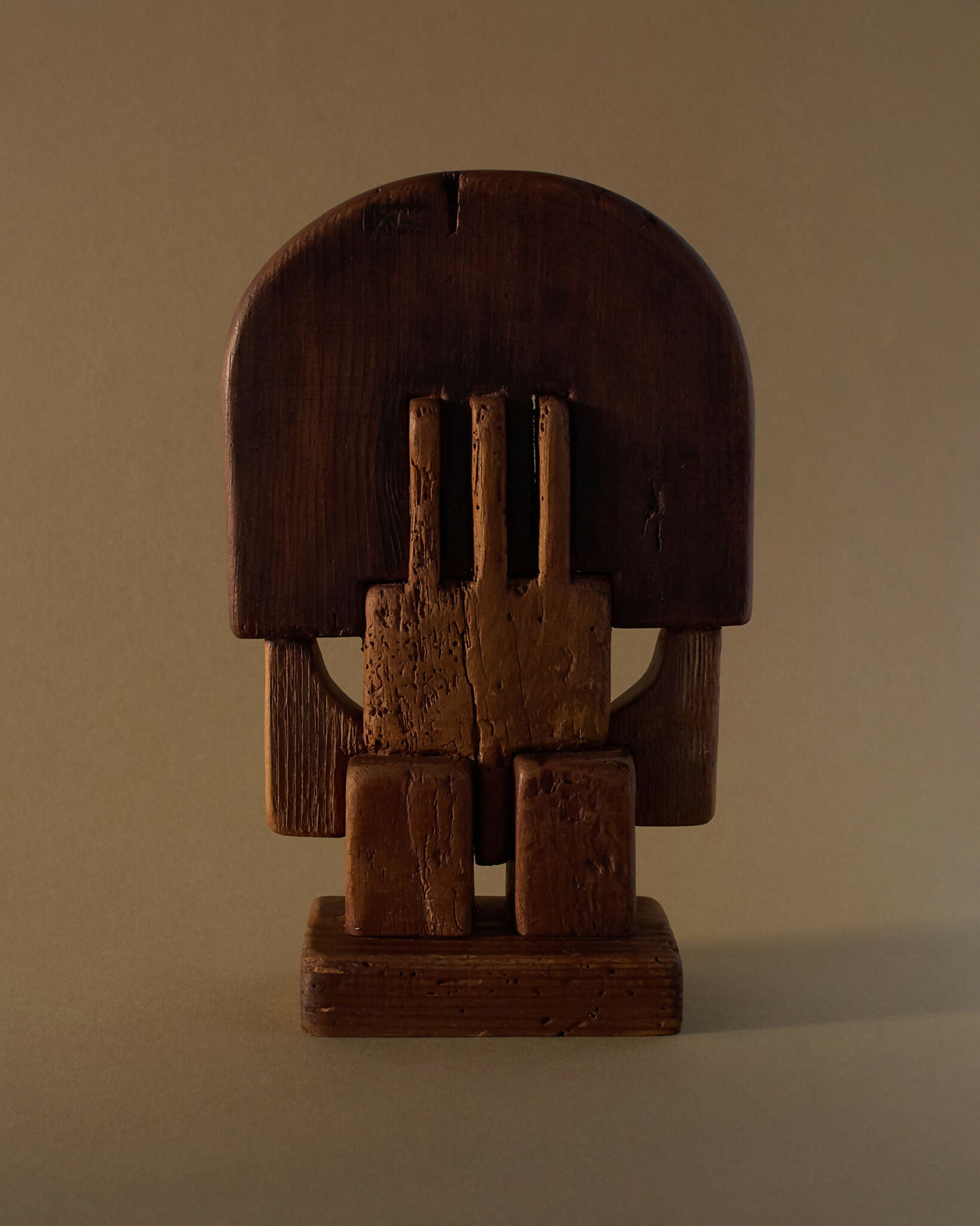 A hand-carved wooden sculpture by Adolf Vallazza, featuring an abstract figure with interlocking forms, with a dark brown to black color, available  to buy on the-salon.com. SALON curates the finest , unique, handmade pieces from the interior industry's best makers and brands. Shop luxury furniture, lighting, rugs, art, antiques and vintage pieces and accessories from SALON interior designed rooms.