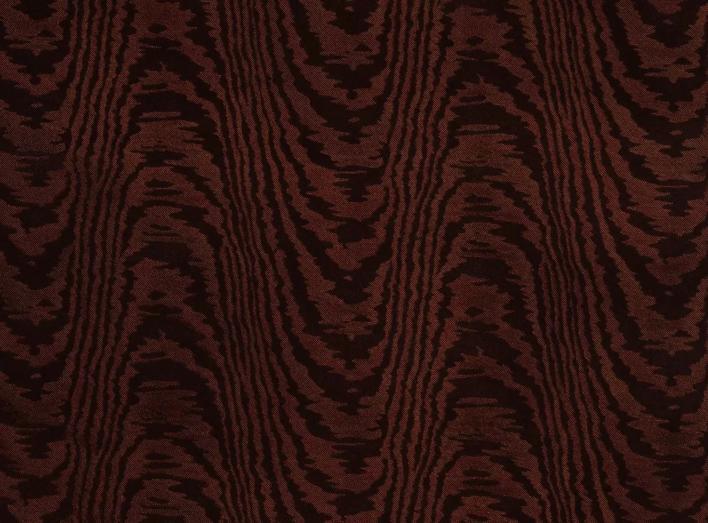 Close-up view of a brown moiré patterned fabric,  available  to buy on the-salon.com. SALON curates the finest , unique, handmade pieces from the interior industry's best makers and brands. Shop luxury furniture, lighting, rugs, art, antiques and vintage pieces and accessories from SALON interior designed rooms.