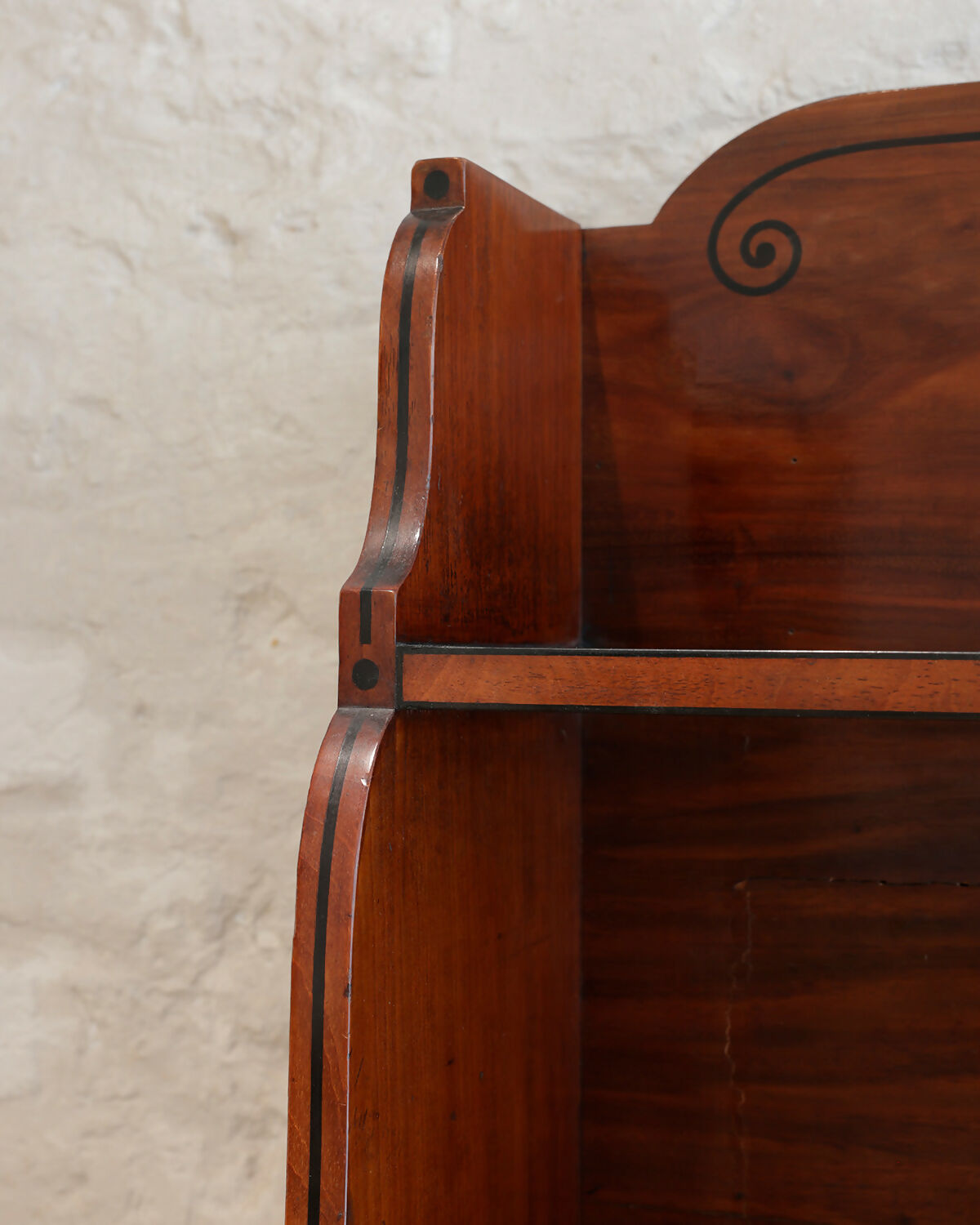 A REGENCY MAHOGANY AND EBONY INLAID WATERFALL BOOKCASE