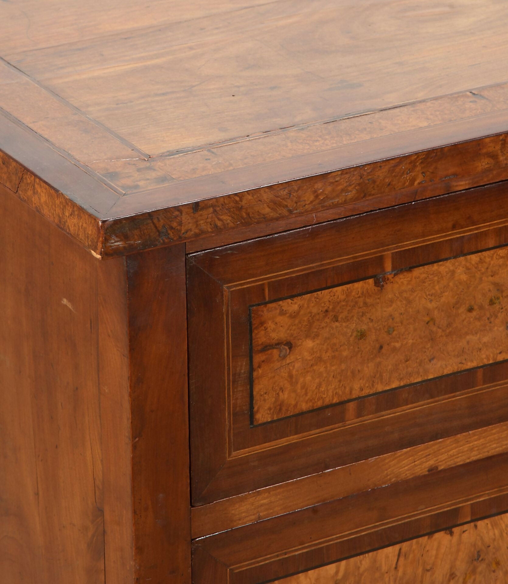 Close-up of a wooden drawer with a focus on the corner and handle,  available  to buy on the-salon.com. SALON curates the finest , unique, handmade pieces from the interior industry's best makers and brands. Shop luxury furniture, lighting, rugs, art, antiques and vintage pieces and accessories from SALON interior designed rooms.