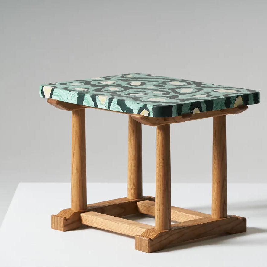 Small wooden table with a patterned green top on a white background,  available  to buy on the-salon.com. SALON curates the finest , unique, handmade pieces from the interior industry's best makers and brands. Shop luxury furniture, lighting, rugs, art, antiques and vintage pieces and accessories from SALON interior designed rooms.
