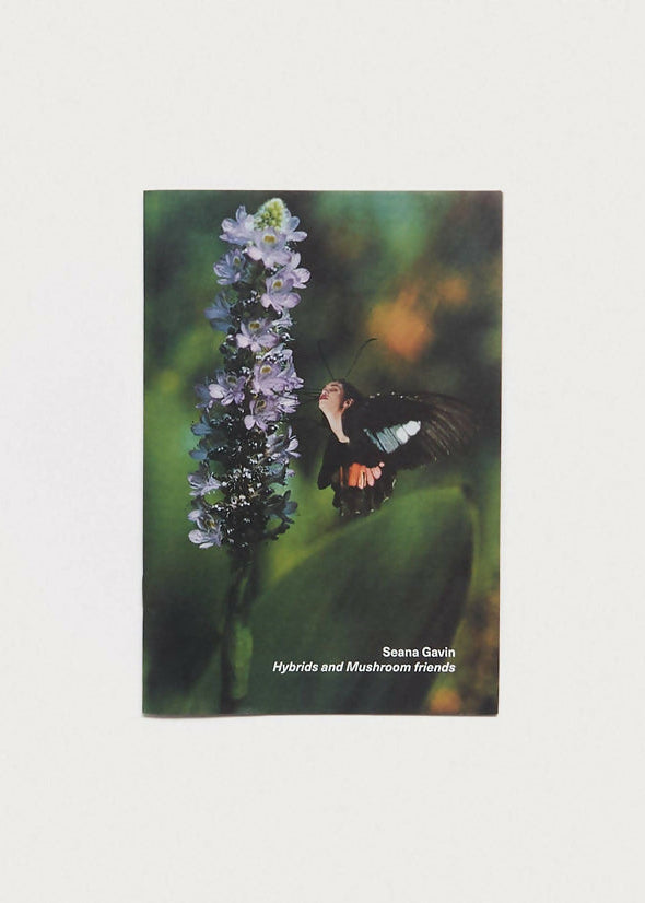Book cover with a butterfly on a flower against a blurred green background,  available  to buy on the-salon.com. SALON curates the finest , unique, handmade pieces from the interior industry's best makers and brands. Shop luxury furniture, lighting, rugs, art, antiques and vintage pieces and accessories from SALON interior designed rooms.